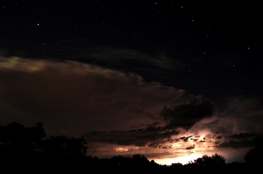 The crest of a large thunderhead stops just shy of the Big Dipper