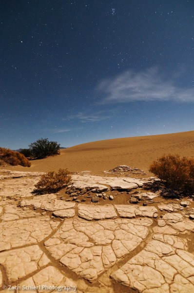 Mudcracks and sand dunes at night, Death Valley