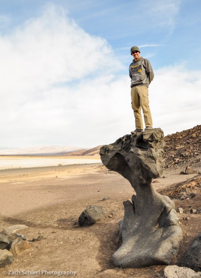 Man standing on ventifact