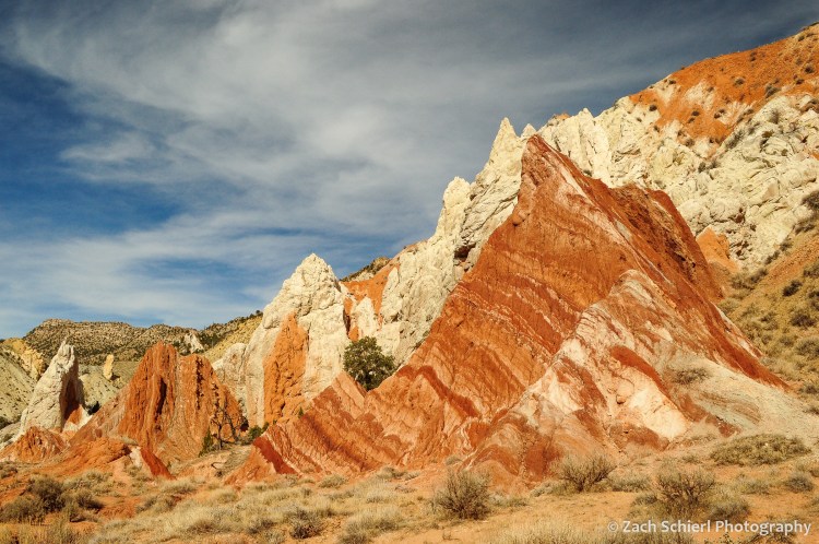 Alternating bands of white and red rock.