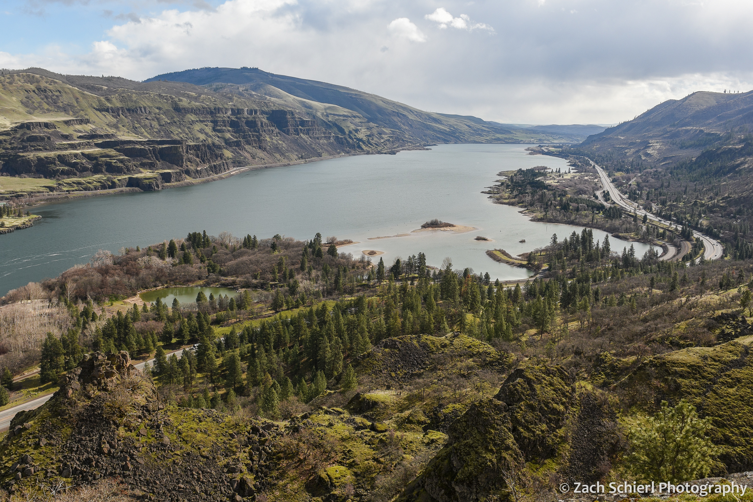 A large river sits at the bottom of a broad, deep gorge.